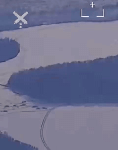 Drone view over snowy terrain with a targeting overlay